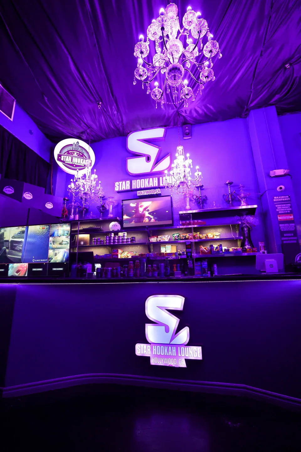 Star’s illuminated sign and crystal chandeliers