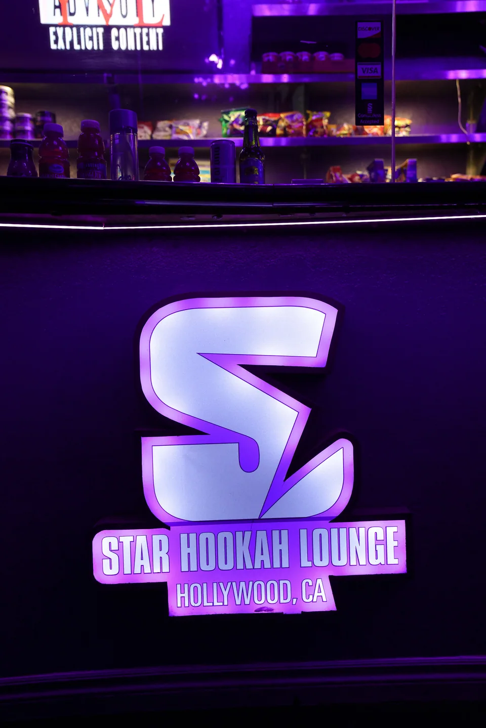 The glowing Star monogram on the bar