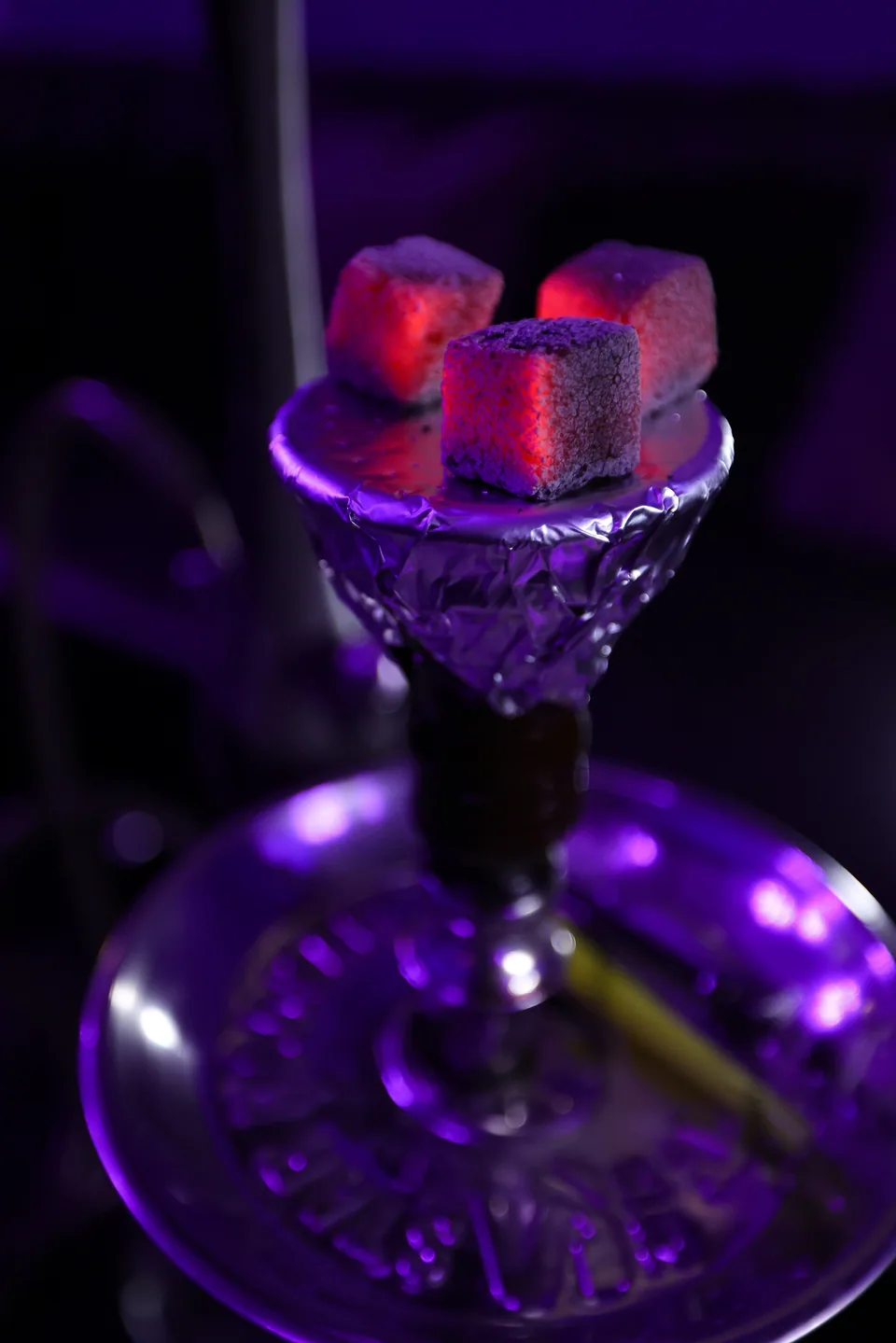 Glowing coals above a cut-glass hookah