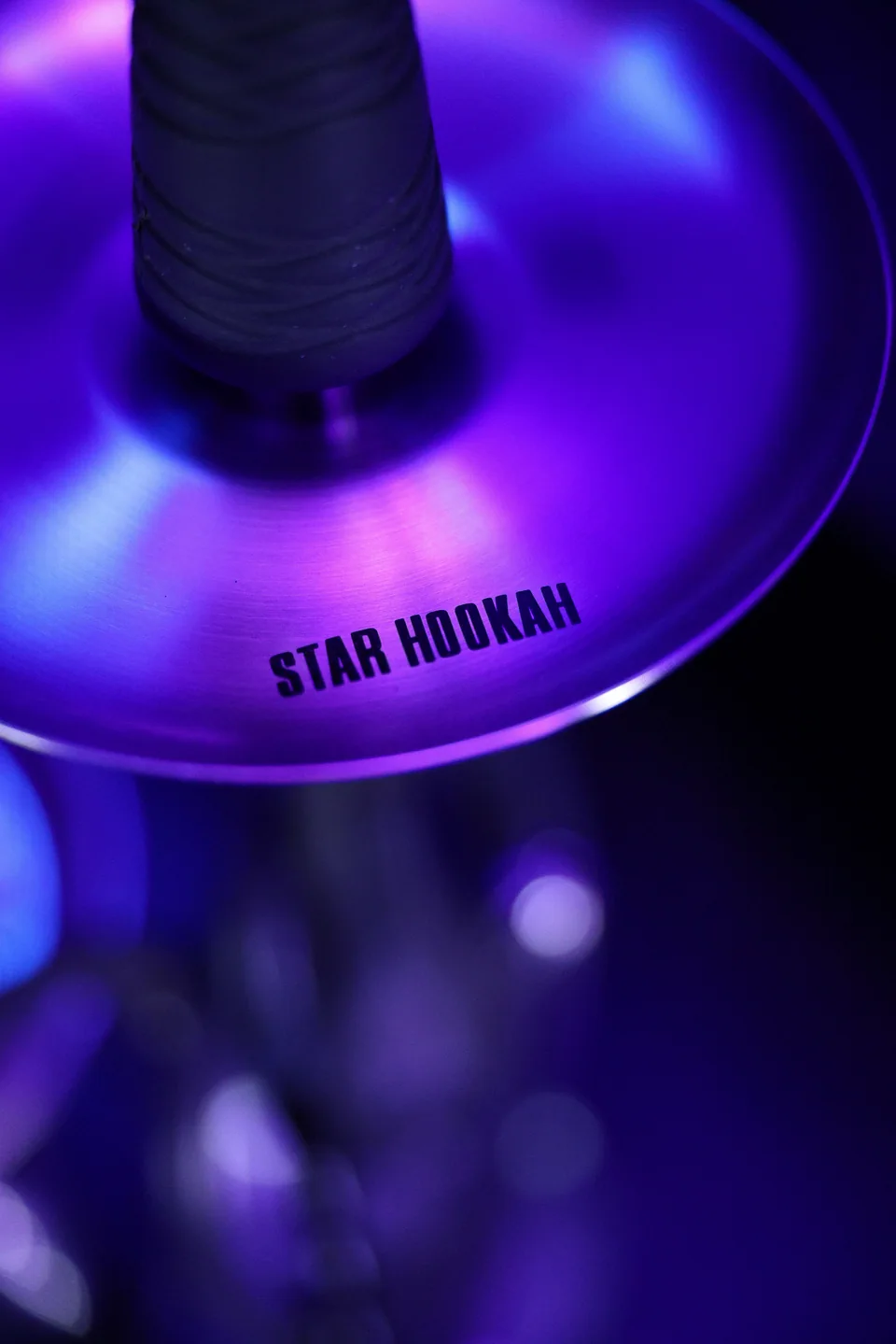 The Star mark on a reflective hookah tray