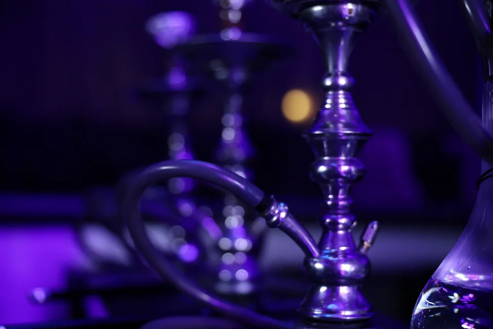 Purple reflections in a hookah glass base